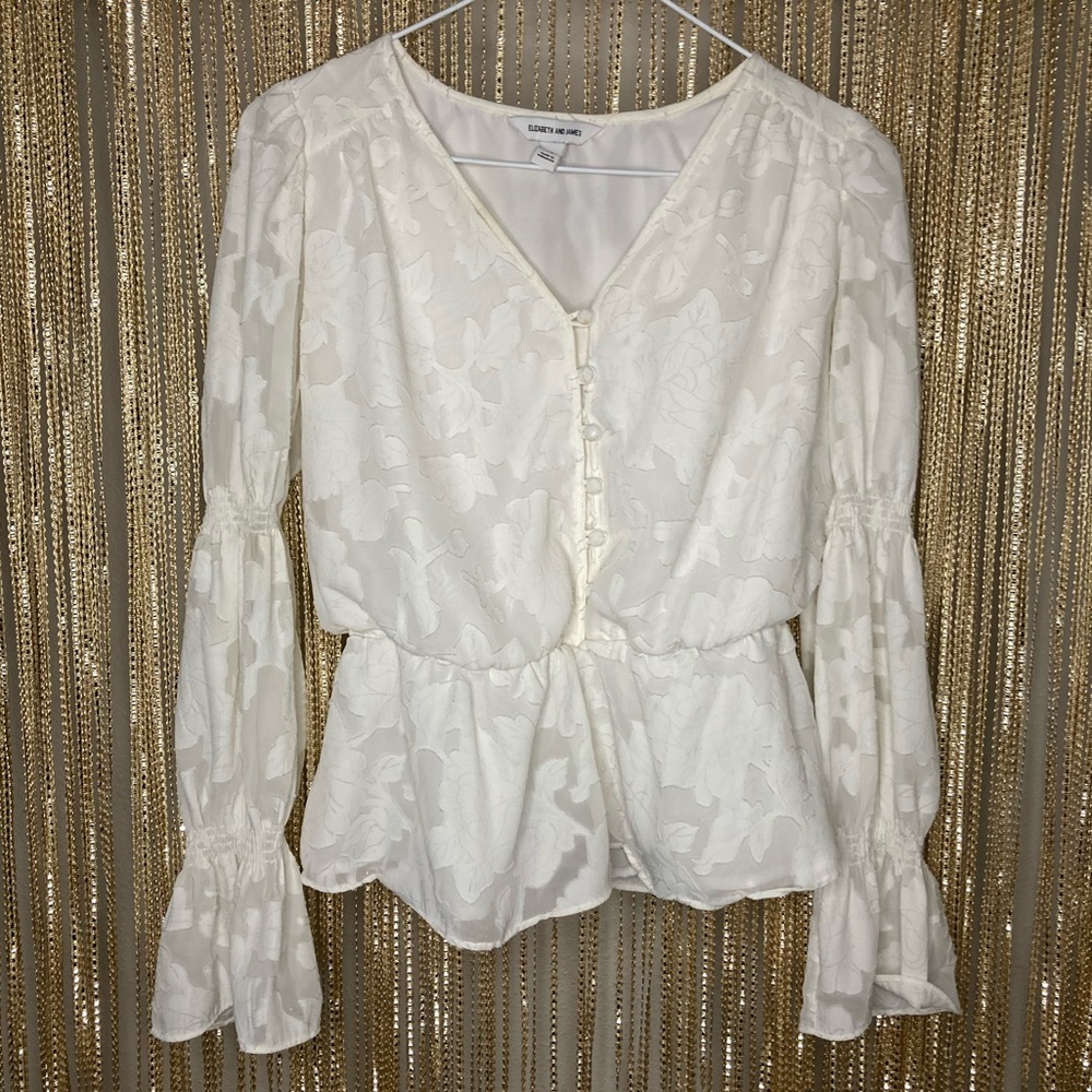 Cream floral peplum top with puffed sheer long sleeves and buttons